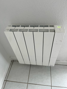 Photo de galerie - Pose d’un radiateur électrique SAUTER 