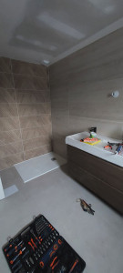 Photo de galerie - Pose bac à douche. meuble vasque double 