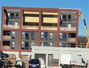 Photo de galerie - Ravalement d’un bâtiment trois couleurs