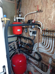 Photo de galerie - Installation bois-solaire thermique avec distribution sur radiateurs