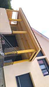 Photo de galerie - Installation de une véranda avec tuile rouges 