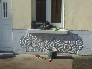 Photo de galerie - Avant : Nettoyage de la façade avant la remise en peinture. 