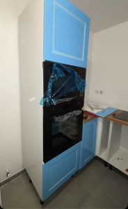 Photo de galerie - Mise en place de four et micro onde, et raccordement de la hôte et plaque de cuisson