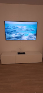 Photo de galerie - Installation du meuble TV et fixation du téléviseur mural
