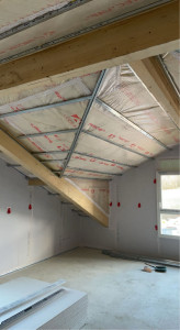 Photo de galerie - Réalisation laine de verre + membrane sur suspente optima, ferraillage rampant