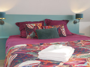 Photo de galerie - Chambre avec serviettes et savon liquide.