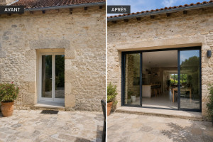 Photo de galerie - Agrandissement d’une ouverture existante en façade en pierre afin de remplacer une porte-fenêtre de dimensions réduites par une baie vitrée coulissante de grande largeur.