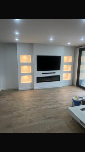 Photo de galerie - Réalisation d’un mur en placo avec électricité et spot intégré sur mesure à la demande du client 