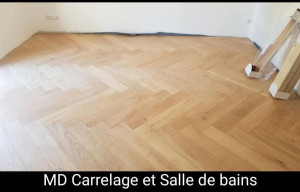 Photo de galerie - Pose parquet contrecollé façon bâton rompu 