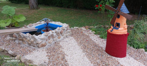 Photo de galerie - Pose de gravier et muret pour cacher un bassin hors sol 