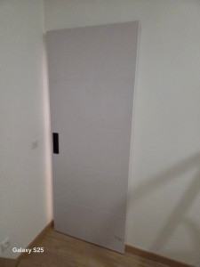 Photo de galerie - Pose d'une porte coulissante 
