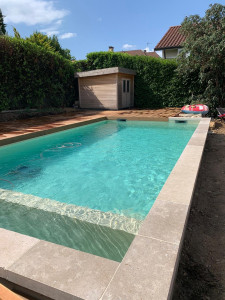 Photo de galerie - Réalisation d’une piscine ainsi que pose de margelles et réalisation d’une terrasse bois exotique 