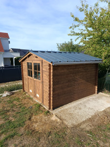 Photo de galerie - Ponçage lasure et pose du toit tôle ( après )