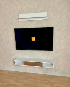 Photo de galerie - Montage + installation meuble TV suspendu + étagère et fixation TV au mur