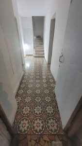 Photo de galerie - Pose de carrleage couloir 25×25
