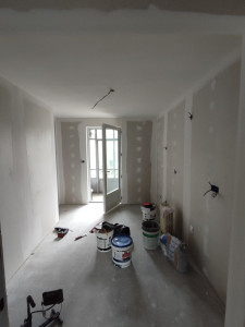 Photo de galerie - Rénovation complète d'une maison - Cuisine - Bandes à joints et ratissage du plafond