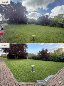 Photo de galerie - Élimination des mauvaises herbes incrustées dans les pavés autobloquants et dégagement des grilles d'évacuation des eaux de pluie. Passage de la tondeuse sur une herbe haute et dense, suivi d'un travail de finition précis autour des obstacles fixés.