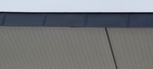 Photo de galerie - Caisson PVC et Habillage des planches de rive en zinc prépatiné.
