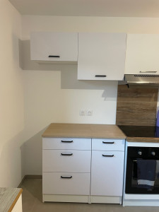 Photo de galerie - Pose îlot cuisine + meubles hauts