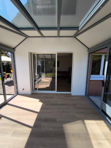 Photo de galerie - Réalisation du placo, enduit, peinture et parquet pvc suite a la construction d'une véranda