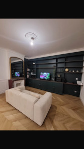 Photo de galerie - Réalisation complète et agencement bibliothèque sur mesure