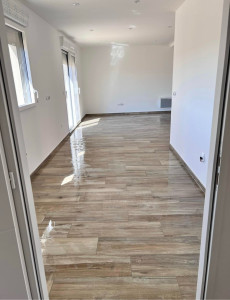 Photo de galerie - Pose carrelage faux parquet un chantier neuf 