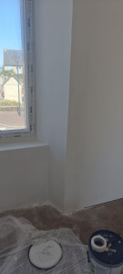 Photo de galerie - Travaux de peinture terminés : murs et finitions impeccables. Chantier propre et soigné.

