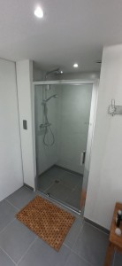 Photo de galerie - Réalisation douche italienne  + carrelage sol et murs + pose d une porte vitrée + éclairage + vmc