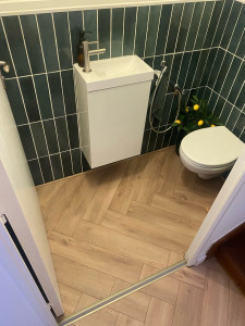 Photo de galerie - Pose de parquet flottant dit : bâton rompu