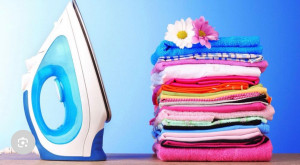 Photo de galerie - Travail de repassage sérieux, vêtements propres et bien présentés. 