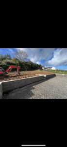 Photo de galerie - Réalisation d’un muret englobant une terrasse béton.