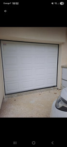 Photo de galerie - Remplacement d'une porte de garage par une baie coulissante avec volet roulant (avant)