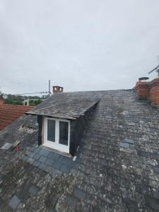 Photo de galerie - Remplacement d'une couverture ardoise avant