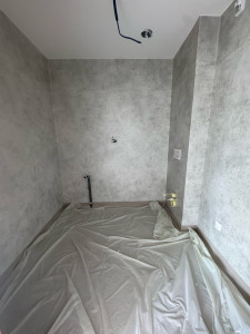 Photo de galerie - Une salle de bain transformée avec un revêtement mural