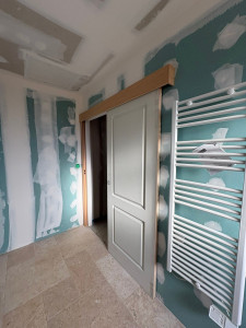 Photo de galerie - Porte coulissante en applique chantier en neuf 