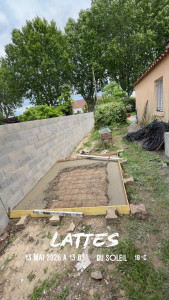 Photo de galerie - Locale jardin avec mur de clôture 