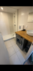 Photo de galerie - Rénovation complète de salle de bain (bac à douche, meuble vasque, carrelage, wc, plan de travail, peinture 