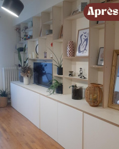 Photo de galerie -  Conception d’une bibliothèque sur mesure, en tenant
 compte des contraintes existantes : une pièce
 étroite nécessitant un meuble peu profond et
 la présence d’une poutre de 17 cm à
 intégrer dans le design.