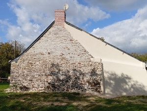 Photo de galerie - Démolition et remise en état d'un mur en pierre, réalisation d'un enduit gratté et des joints de pierres