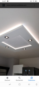 Photo de galerie - Réalisation d’un plafond suspendu design avec pose de spots.
