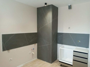 Photo de galerie - La réalisation de la pose du carrelage sur le sol chauffant