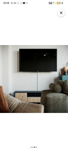 Photo de galerie - Pose d'une tv sur  un mur au placoplâtre.