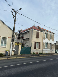 Photo de galerie - Voici le résultat obtenu suite au remplacement des éléments en ardoise par des tuiles.