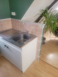 Photo de galerie - Pose de carrelage 
dans une cuisine 
