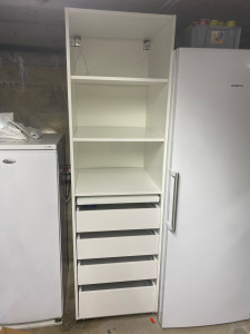 Photo de galerie - Montage d’un meuble pour un garage avec tiroirs et tablette rétractable