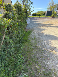 Photo de galerie - Création d’un talus avec pose de bâche ainsi qu’empierrement 