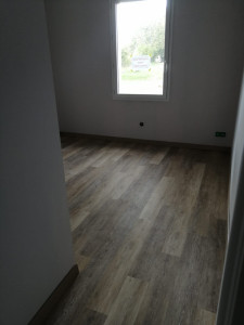 Photo de galerie - Sol PVC a clipser pour une chambre 